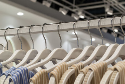 Clothes hanging on rack in store