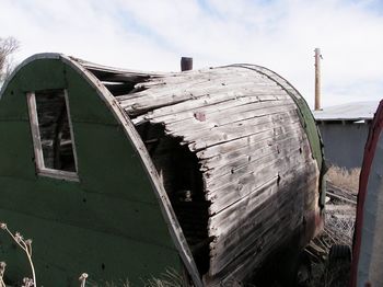 Low angle view of building against cloudy sky