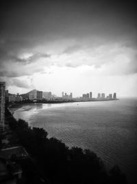 View of buildings against cloudy sky