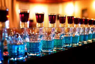 Close-up of cocktails in glasses on table at bar