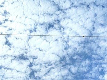 Low angle view of vapor trail against sky