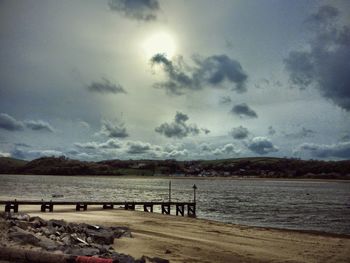 Scenic view of sea against cloudy sky