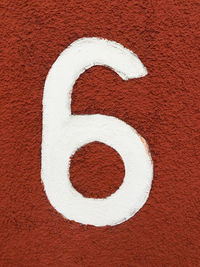 High angle view of number on yellow wall