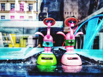 Close-up of toy car by window
