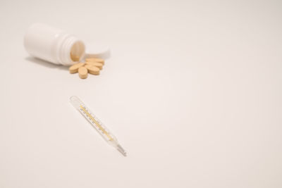 Close-up of pills against white background