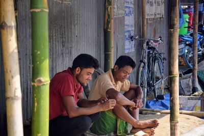 Young man using smart phone outdoors