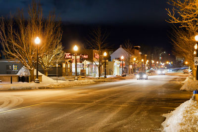 Illuminated street at night