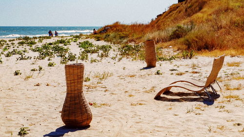 Scenic view of beach against clear sky