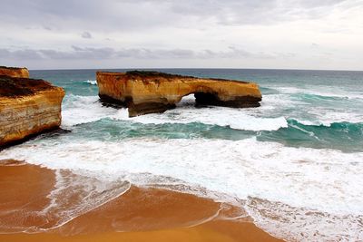 Scenic view of sea against cloudy sky