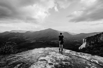 Scenic view of mountains against cloudy sky