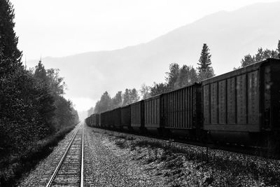 Train on railroad track against sky