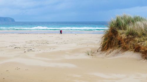 Scenic view of beach against sky