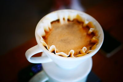 Close-up of coffee in cup on table