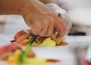 Close-up of person preparing food