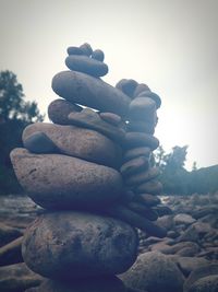 Close-up of pebbles against clear sky