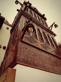 Low angle view of temple against building