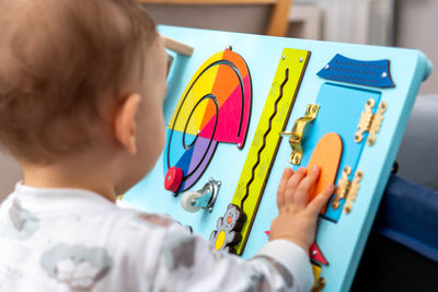 Close-up of boy drawing on table