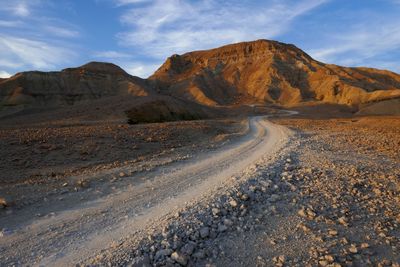 Scenic view of mountain road against sky