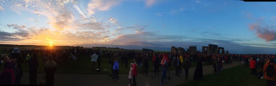 Panoramic view of people at sunset