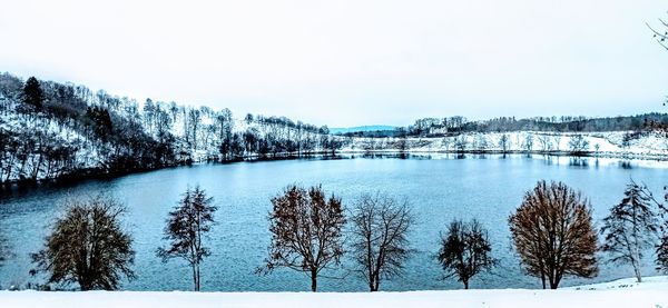 Scenic view of frozen lake against sky during winter