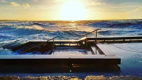 Scenic view of sea at sunset