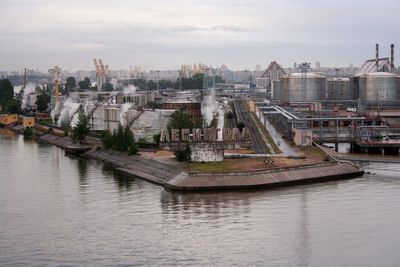 Panoramic view of river and buildings against sky