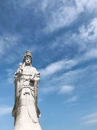 Low angle view of statue against sky