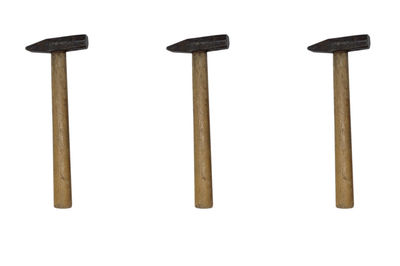 Directly above shot of metal equipment against white background