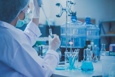 Scientist examining chemical in laboratory