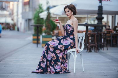 Portrait of young woman standing outdoors