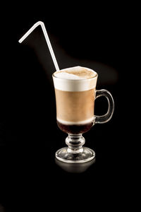 Close-up of coffee cup against black background