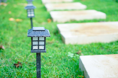 Close-up of birdhouse on field