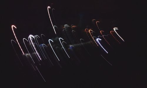 Low angle view of illuminated ferris wheel