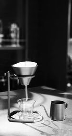 Close-up of dip coffee equipment  on table in coffee shop