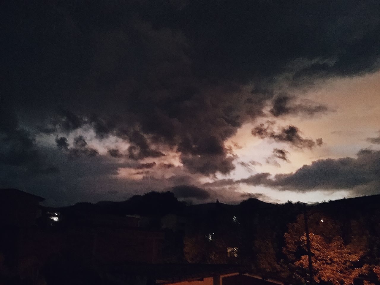 cloud - sky, sky, building exterior, architecture, built structure, no people, nature, beauty in nature, sunset, scenics - nature, overcast, building, silhouette, storm, outdoors, storm cloud, city, environment, dusk, ominous, power in nature