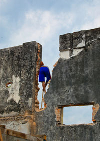 Low angle view of old building against sky