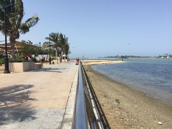 Scenic view of beach against clear sky