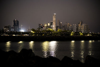 Illuminated city at waterfront