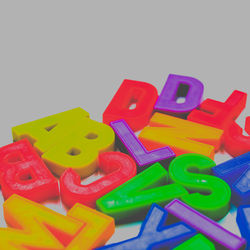 Close-up of colorful balloons on white background