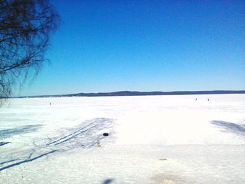 Scenic view of sea against clear sky during winter