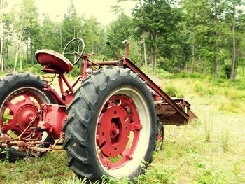 Abandoned tractor on field