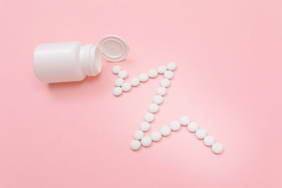 High angle view of pink bottle on table