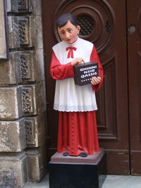 Portrait of man standing in front of door