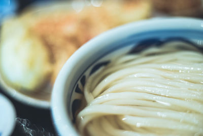 View of noodles soaked in water in bowl