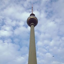 Low angle view of tower against cloudy sky