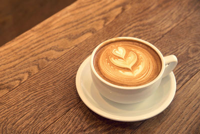 High angle view of cappuccino on table