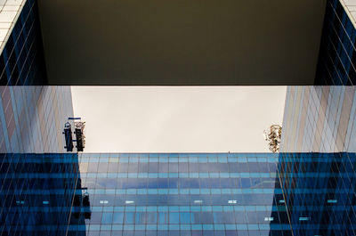 Digital composite image of modern building against sky