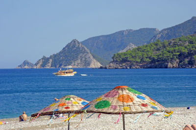 Scenic view of sea against mountains