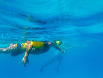 People swimming undersea