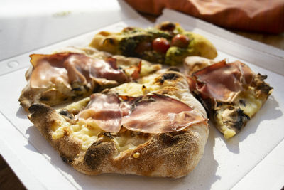 High angle view of pizza in plate on table